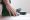 business man scratch the itch by hand with athlete foot problem